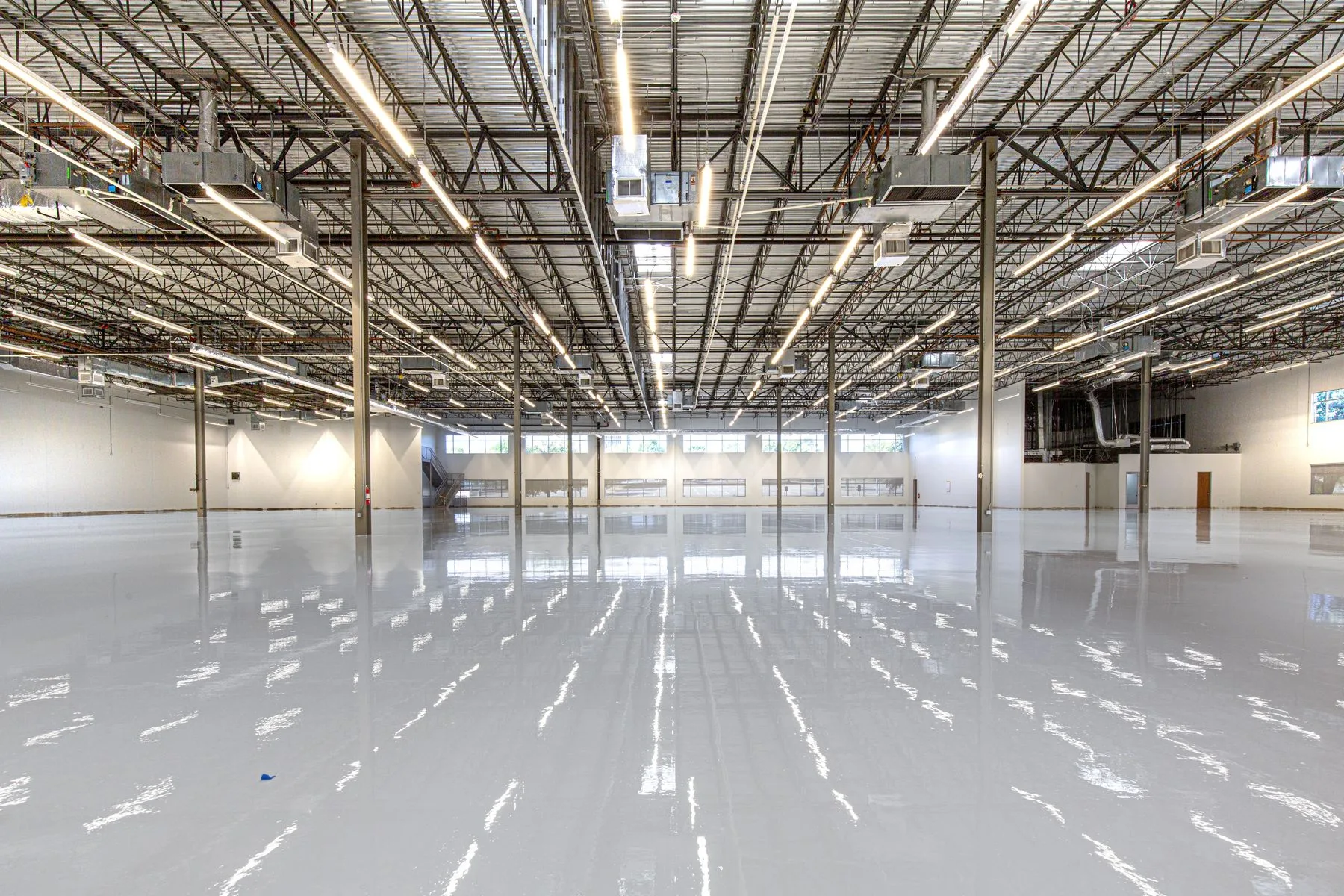 Glossy epoxy floor in a large industrial facility